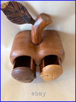 Amazing folk art wooden sculpture, two faces on drawers that open from an apple