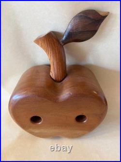 Amazing folk art wooden sculpture, two faces on drawers that open from an apple