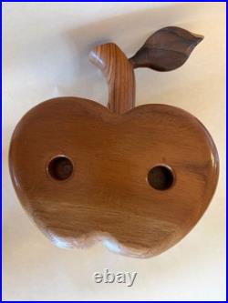 Amazing folk art wooden sculpture, two faces on drawers that open from an apple