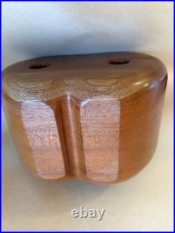 Amazing folk art wooden sculpture, two faces on drawers that open from an apple