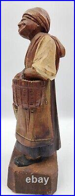 Antique folk art wood carving of a woman with basket Charles Dickens character