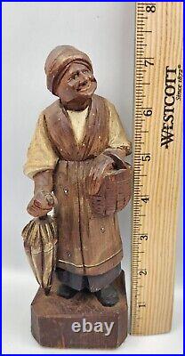 Antique folk art wood carving of a woman with basket Charles Dickens character
