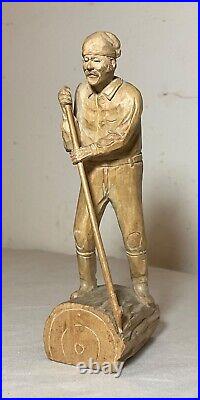 Antique hand carved wood Folk Art lumberjack man cutting wood sculpture statue