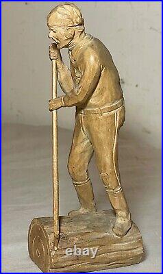 Antique hand carved wood Folk Art lumberjack man cutting wood sculpture statue