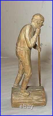 Antique hand carved wood Folk Art lumberjack man cutting wood sculpture statue