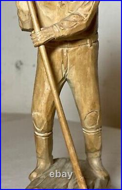 Antique hand carved wood Folk Art lumberjack man cutting wood sculpture statue