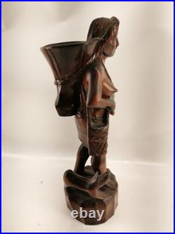 Carving of indigenous woman, carved in noble woods Carving of indigenous woman, carved in noble woods