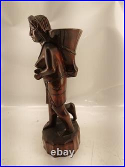 Carving of indigenous woman, carved in noble woods Carving of indigenous woman, carved in noble woods