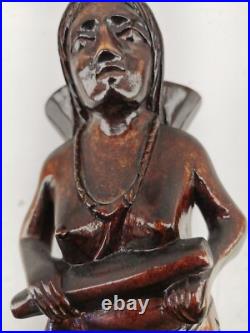 Carving of indigenous woman, carved in noble woods Carving of indigenous woman, carved in noble woods