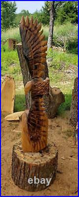 Chainsaw Carving Eagle Soaring. Chainsaw carved eagle, 3 foot tall wood chainsaw