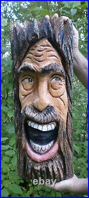 Chainsaw carved happy face wood spirit. Chainsaw carvings, home or garden decor