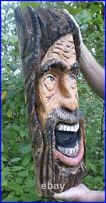 Chainsaw carved happy face wood spirit. Chainsaw carvings, home or garden decor