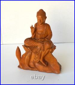Hand-Carved Wooden Meditating Buddha Statue sitting on flower ontop of mount