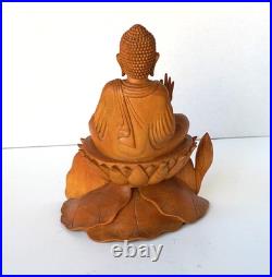 Hand-Carved Wooden Meditating Buddha Statue sitting on flower ontop of mount