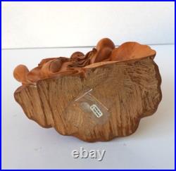 Hand-Carved Wooden Meditating Buddha Statue sitting on flower ontop of mount