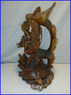 Hand Carved Wooden Statue. From The Bali Region