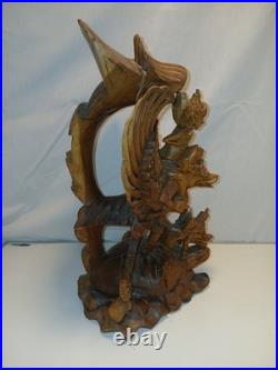 Hand Carved Wooden Statue. From The Bali Region