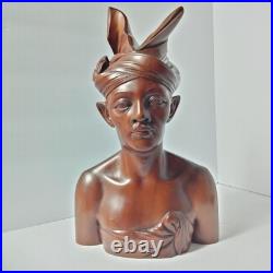 Hand-carved wooden bust of a Balinese man wearing traditional headdress'udeng