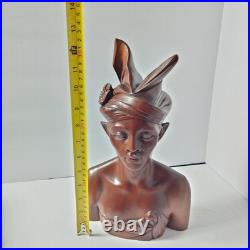 Hand-carved wooden bust of a Balinese man wearing traditional headdress'udeng
