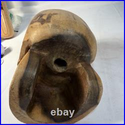 Hand-carved wooden skull sculpture 8'