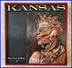 Kansas Masque Album Wood Carving