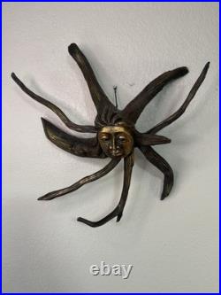 Root carved sun goddess wall hanging