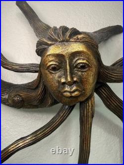 Root carved sun goddess wall hanging