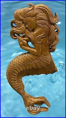 Teak mermaid sculpture