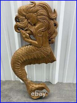 Teak mermaid sculpture