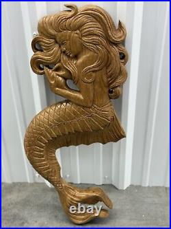 Teak mermaid sculpture