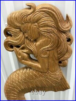 Teak mermaid sculpture