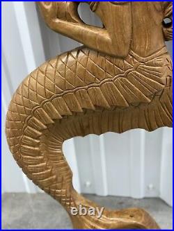 Teak mermaid sculpture