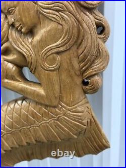 Teak mermaid sculpture