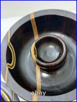 This is a handcrafted segmented wood bowl This is a handcrafted segmented wood bowl