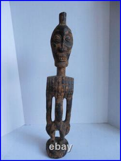 Vintage African figural wooden carving with brass. 27