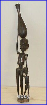 Vintage African hand carving wood statuette man carry vessel on his head