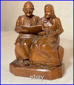 Vintage hand carved German wood elder man lady reading sculpture statue figure