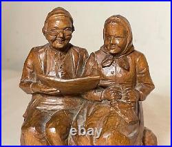 Vintage hand carved German wood elder man lady reading sculpture statue figure